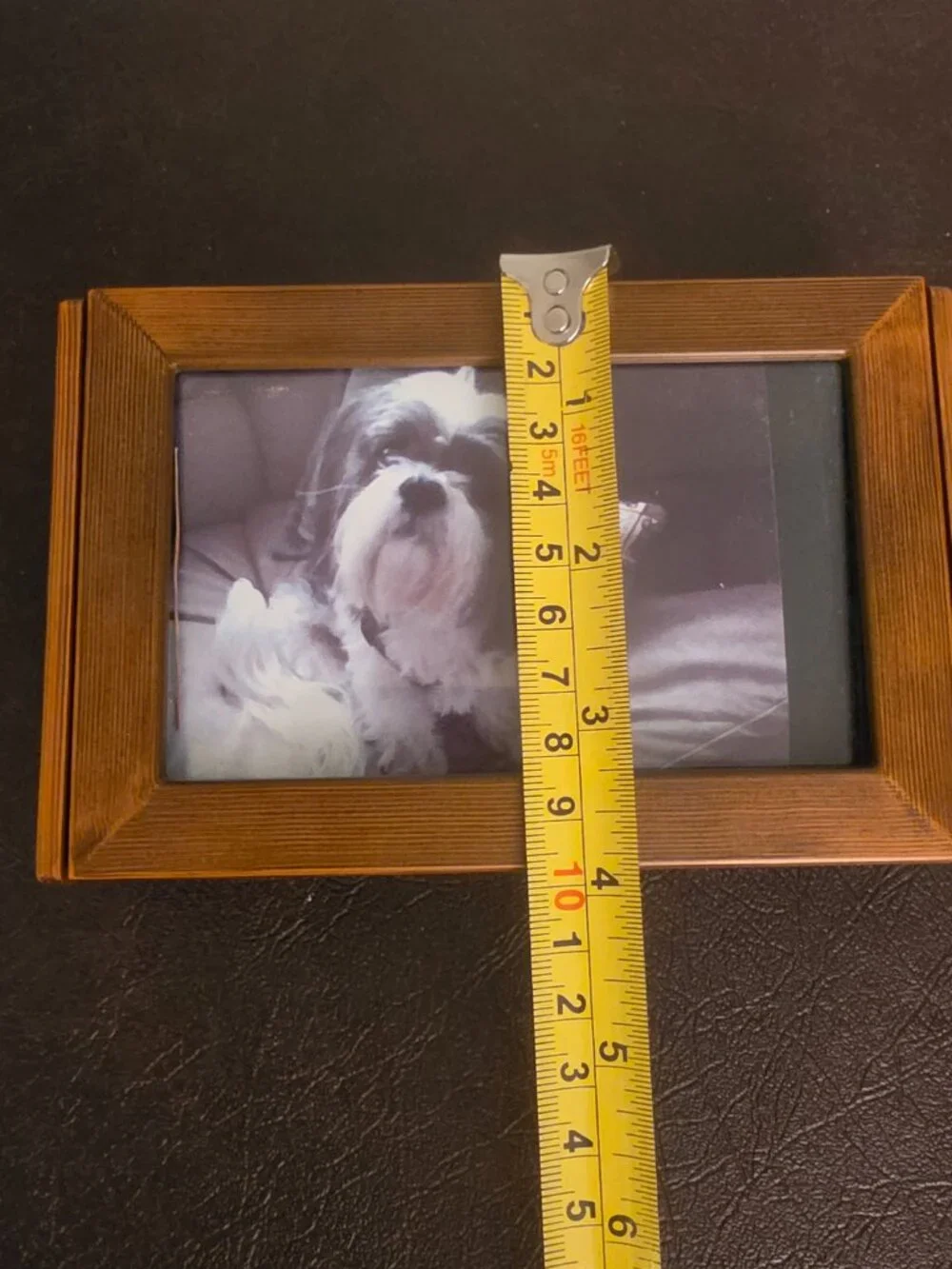 Vintage wooden jewelry box with a picture frame features a rectangular shape